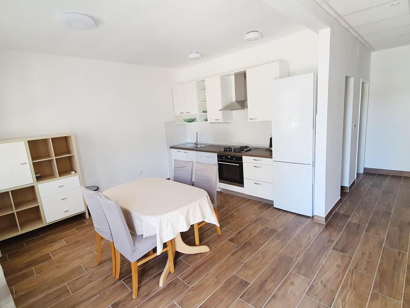 Kitchen with dining area in Apartment S1-A